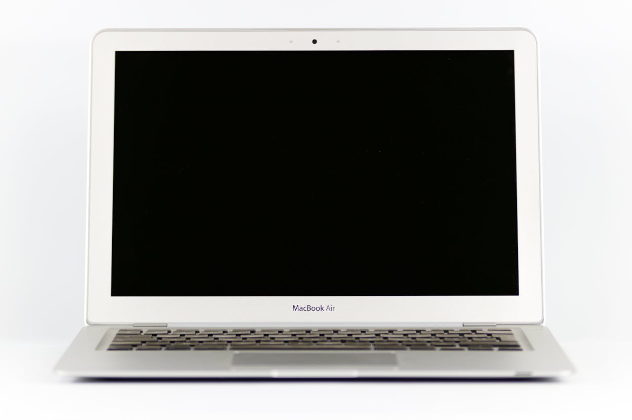 award-img Front view of a MacBook Air laptop with a blank screen on a white background.